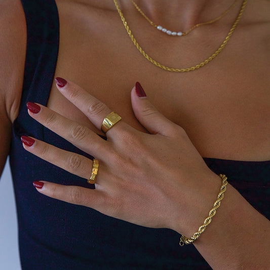 Model wearing gold plated rope bracelet
