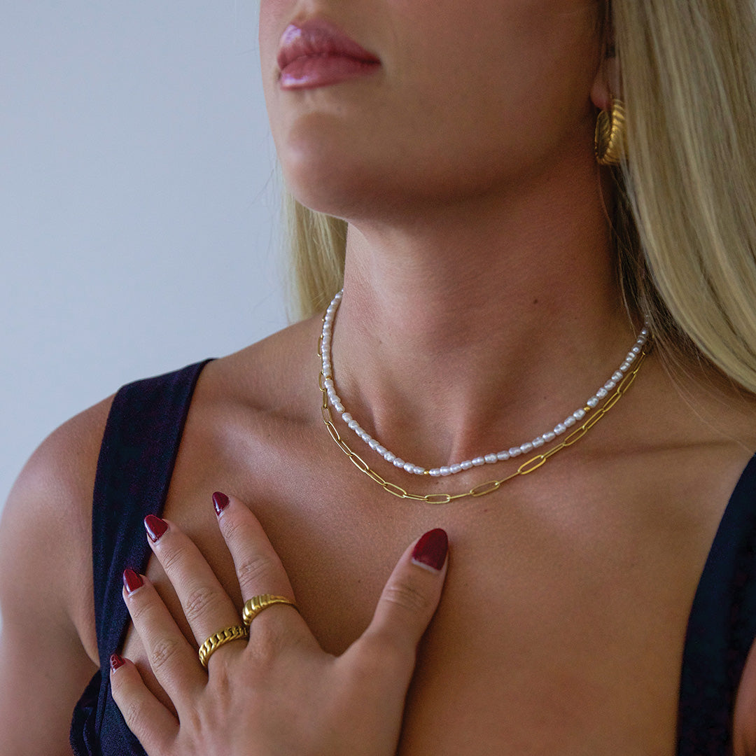 Model wearing pearl necklace gold plated jewellery