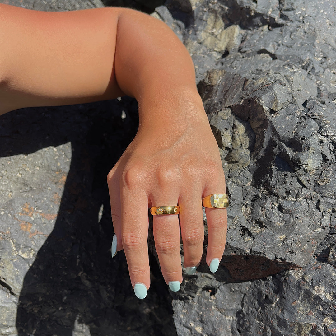 model wearing chunky gold plated round rings